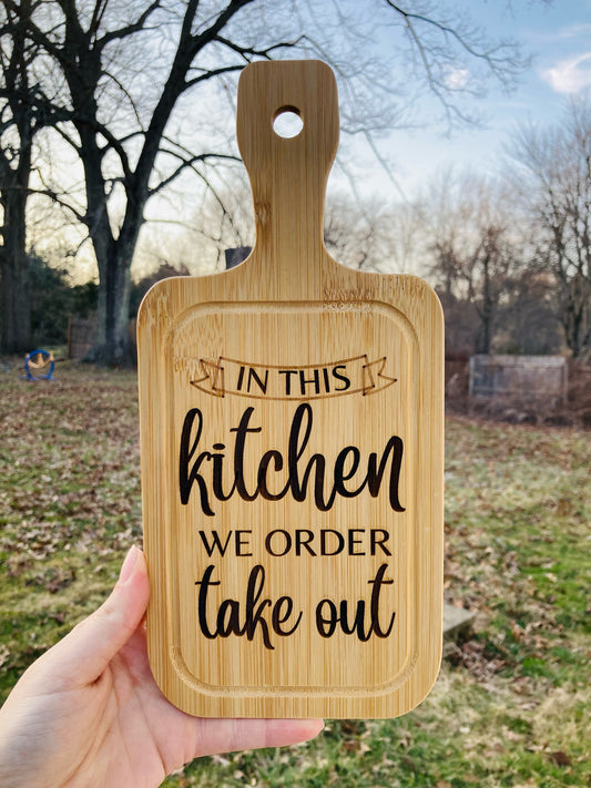 "In This Kitchen We Order Take Out" Bamboo Cutting Board